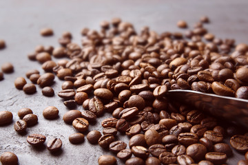 Coffee beans with scoop, close up