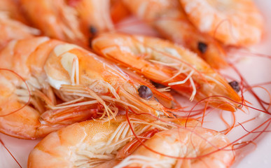 Baked butter shrimp on white dish