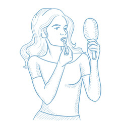 Young woman rouge lips with lipstick.