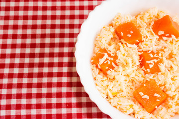 Pumpkin Risotto in a white plate. Italian Cuisine.