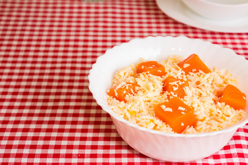 Pumpkin Risotto in a white plate. Italian Cuisine.