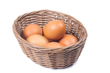 egg in basket wicker on white background
