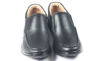Black leather shoes on white background
