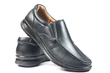 Black leather shoes on white background
