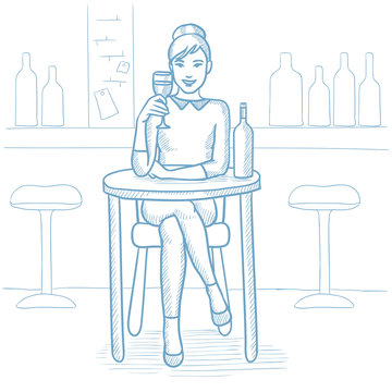 Woman drinking wine at restaurant