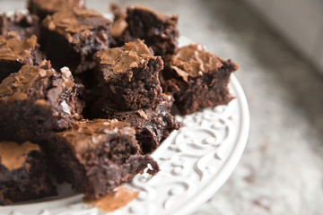small pieces of brownies on white plate