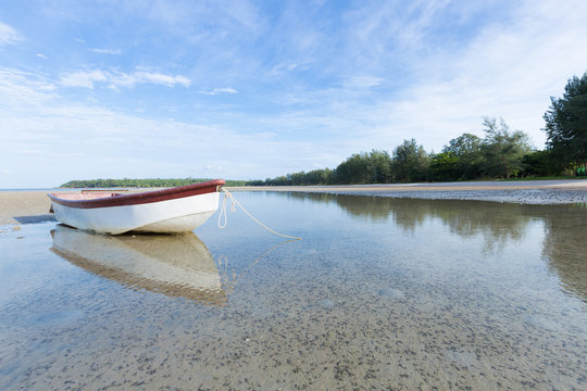 small boat on the beach