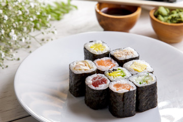 various of maki sushi on white plate