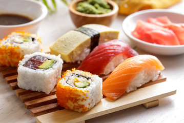 Sushi Set nigiri sushiand maki sushi served on wooden plate