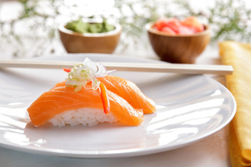 japanese food nigiri salmon sushi on white plate