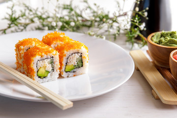 japanese cuisine california maki sushi on white plate