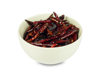 Roested dried red chili pepper in cup on white background