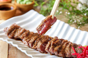 japanese food wafu steak with chopsticks