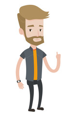 Smiling businessman pointing with his forefinger.