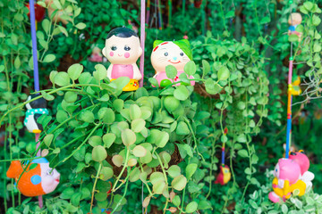 Dave and dolls hanging in the garden.