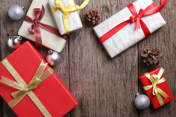 Presents on wooden surface with christmas decoration