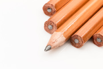 Pencil points, one sharpened on a white background.