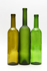 three empty bottles of wine on white background