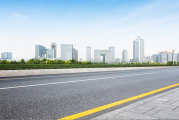 Fototapeta na wymiar cityscape and skyline of nanjing from empty asphalt road