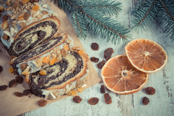 Vintage photo, Homemade poppy seeds cake and spruce branches, dessert for Christmas