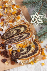 Homemade poppy seeds cake and spruce branches, dessert for Christmas