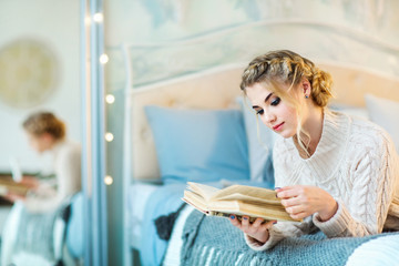 Beautiful teen girl with a book