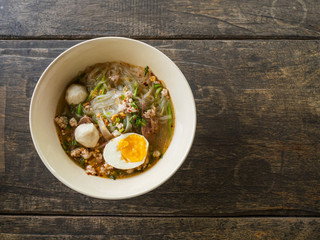 close up thai noodle on wood table background with space