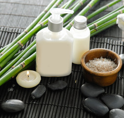 towel and stones and oil,grove on bamboo mat	