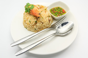 Fried rice with crab and shrimp serve with Thai hot and spicy seafood sauce and Cutlery Set, isolated on a white background. Fried rice thai style Asia Thailand