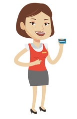 Cashier holding credit card at the checkout.