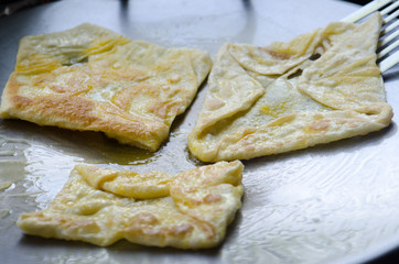 .Roti on a pan of hot smoke and the smell of incense wafting app