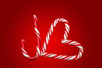 Red and white candy canes arranged in a J and a heart, symbols o