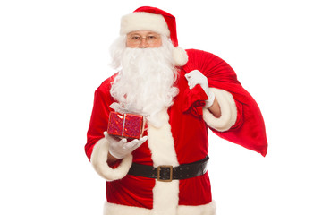 Santa Claus: Cheerful With Small Stack Of Gifts big bag, isolated on white background Christmas.