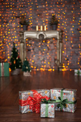 Christmas gift in front of a fireplace