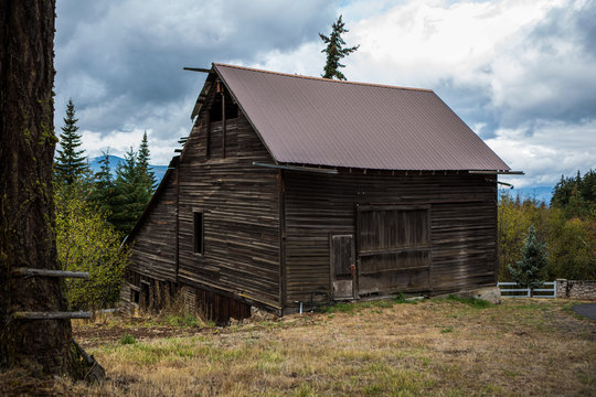 An old barn in the hills above the trees