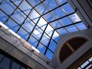 View on blue sky through solarium rooftop 