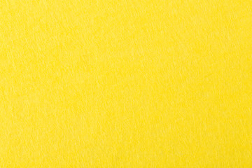 Background of bright yellow felt.
