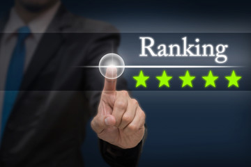 Businessman pointing five star button to increase ranking of hot