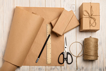 Wrapping Christmas gifts in Kraft paper and rope.