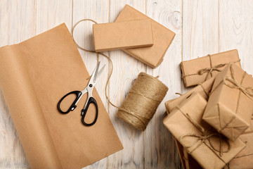 Wrapping Christmas gifts in Kraft paper and rope.