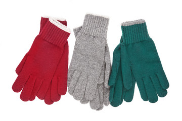 three pairs of knitted gloves