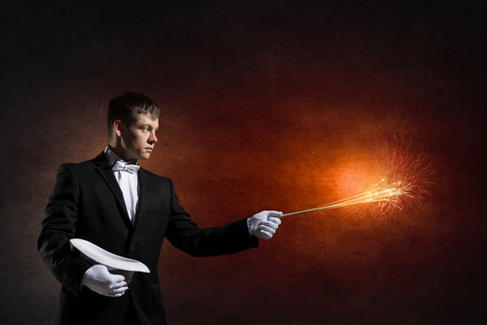 Businessman demonstrating magic . Mixed media