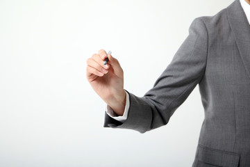 business woman holds a ballpoint pen