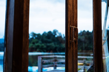 Close-up wooden glass classic door in evening