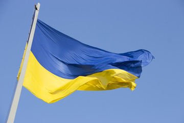Ukrainian flag on a background of blue sky