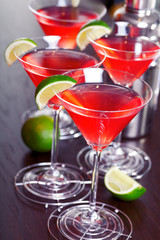 Cosmopolitan cocktails shot on a bar counter in a nightclub. Low