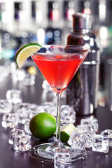 Cosmopolitan cocktails shot on a bar counter in a nightclub. Ful