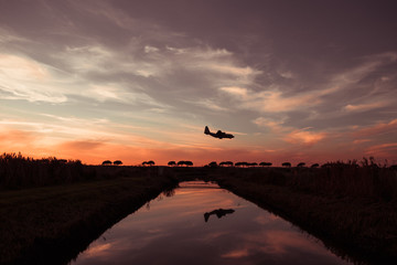 Passenger Turbofan Airplane is Approaching at the Airport with the Gears down on the top of a...