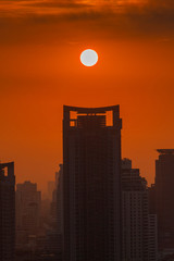 Big sun rising over Bangkok city skyline, Cityscape sunset