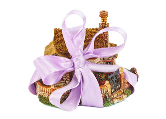 Toy house with bow as gift